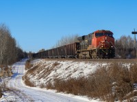 CN U 77851 03 rolls through Kapasiwin, just east of Wabamun with CN 2816 and 153 cars.  U 778 operates from Prince Rupert, BC to Keenan, Minnesota;  The train will return loaded with ore from the DM&IR Iron Range, for export to Asia.