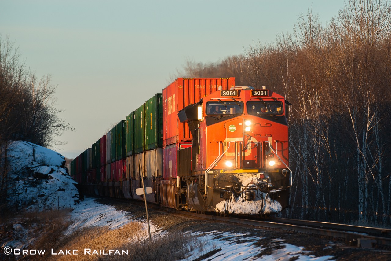 In an odd turn of events and a timely meet at Tichborne pushing this train into daylight, CN 3061 leads CP 112 past Crow Lake.
The hotbox detector reported a bitterly cold -16c and for the second time in a row I froze my fingers getting the shot. Yet again it was worth it.