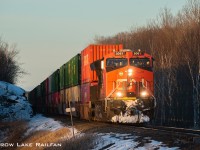 In an odd turn of events and a timely meet at Tichborne pushing this train into daylight, CN 3061 leads CP 112 past Crow Lake.
The hotbox detector reported a bitterly cold -16c and for the second time in a row I froze my fingers getting the shot. Yet again it was worth it.
