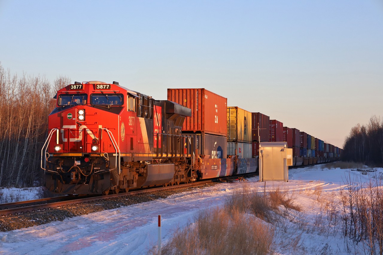Q 19991 03 catches the last rays of sunlight as they highball across the Alberta Prairie.  By the time the sun comes up in 18 hours, the train will be in the heart of Northern BC.