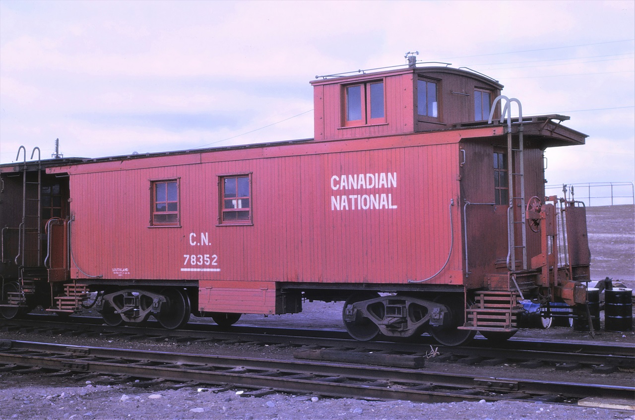 One of the original "end of train" devices, not usually equipped with a flashing device, but often a waving device, rests on the old icehouse track at Capreol, Ontario in October 1966.  This paint scheme is rather unique.