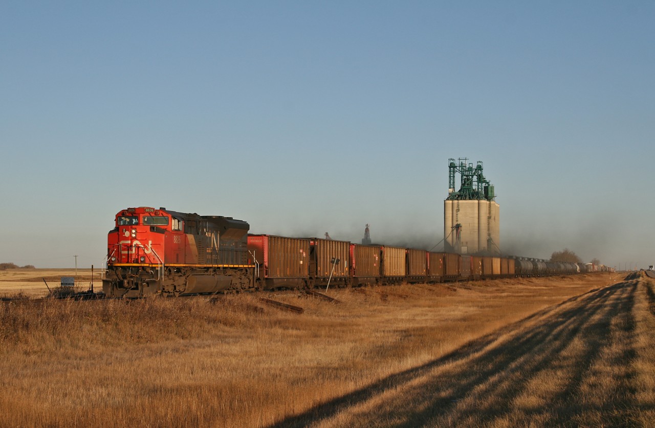 A 41141 13 rolls through Lavoy as the sun sets on the prairies