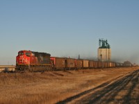 A 41141 13 rolls through Lavoy as the sun sets on the prairies