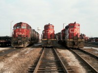 Those old days at Fort Erie. So much activity. I felt a huge loss when operations ceased there. Most days 8 or 10 locomotives could be found; some in the middle of heavy repair, some fueling and some set up and ready to take a train out when required. I like to think this is what this shot is all about. CN 2337 along with CN 4224 and CN 4596 are lined up looking ready to go. Did not record the other units. Oh well. Live and learn.
In the background is the old Niagara Region Fort Erie water tower that I used as photo ID.
