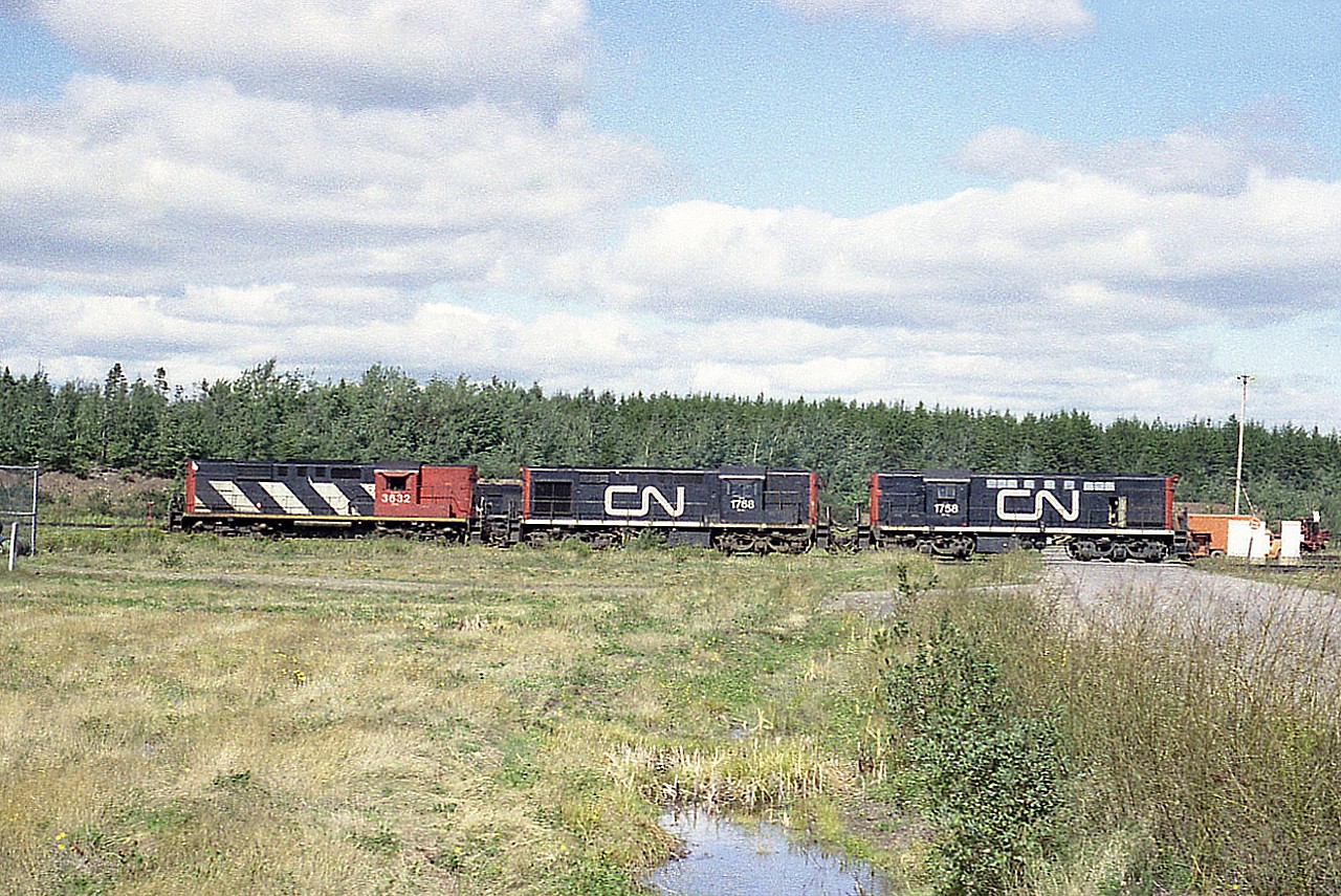 Back in the day when it was relatively easy to wander that big CN yard complex just outside of Moncton, New Brunswick.  This shot is of CN 3632 (RS-18) and CN 1768, 1758 (both RSC-14) about to go around the wye at the west end of the facility.  GPS coordinates are approximate.  Just can't be sure. It has been a long time.