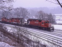 Today it finally felt a bit like winter. Rather late this year; seeing it is Dec 8th, but the couple of centimetres of snow that fell is hanging around. Good day to post a snow shot from 40+ years back. This image was taken within the first two weeks of December 1978. Afternoon Starlite, with CP power, 5726, 5664 and 8114 is Hamilton-bound as seen from the hillside at the Royal Botanical Gardens. Everything about this image shouts C-O-L-D. Sure do not like winter as much as I used to. :o)