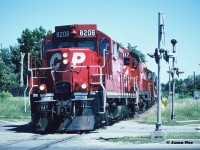 During the summer of 1997, a friend and I decided we needed to attempt to photograph the Canadian Pacific “Moonlight” on what remained of the CP Owen Sound Subdivision between Streetsville and Orangeville. At the time it was a spare-board assignment out of Lambton Yard in Toronto and if memory serves it was ordered at 13:00 on Monday-Wednesday-Friday. 
<br>
After a couple failed attempts, on Monday, July 7 the Moonlight Job arrived in Streetsville with CP 8208, 1117 and 8243 at 14:45 according to my notes. From there the chase would begin. With mid-day summer sun still an issue we headed north hoping for better angles. Here at Mile 8 in Brampton, the Moonlight is viewed heading north at the double crossings at Williams Parkway, which still today have CPR stamped on the signal posts according to Google Street View. 
