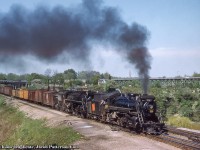 With helper 3509 tied on, CNR Extra 6217 west departs Bayview Junction taking the switch to the Dundas Subdivision.  The consist includes a number of outside braced wooden boxcars and Pacific Fruit Express reefers (some empty with open hatches).<br><br>CNR S-1-g, 2-8-2 Mikado 3509 was built by the Canadian Locomotive Company of Kingston in 1917 for the Grand Trunk as 489.  It would receive the number 3509 during the 1923 consolidation under the Canadian National Railway, and would be scrapped in March 1960.  CNR U-2-g, 4-8-4 Northern 6217 built by MLW in September 1942 and would be scrapped in July 1961.<br><br><i>Original Photographer Unknown, Al Chione Duplicate, Jacob Patterson Collection Slide.</i>