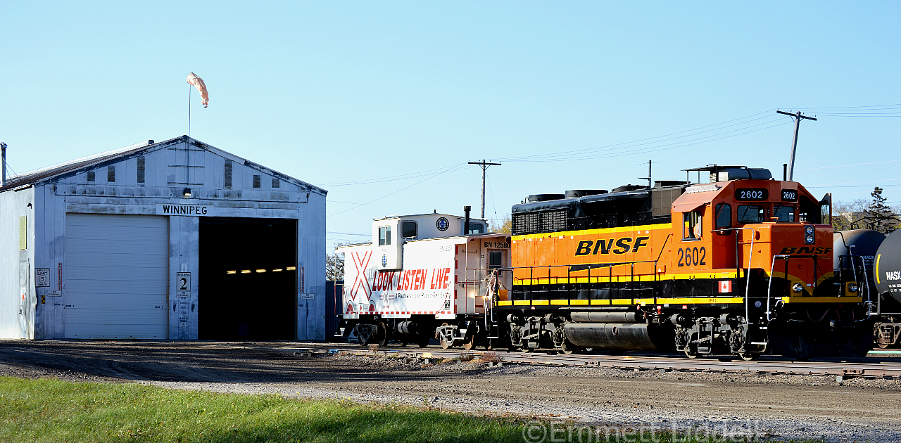 On a very short day for the BNML crew. We caught them shoving the BN Operation Caboose back into the shop. It is very uncommon for them to pull the Caboose out. Also, note the magnet Canadian Flag on the front Right of BNSF 2602, which is a GP39-3.