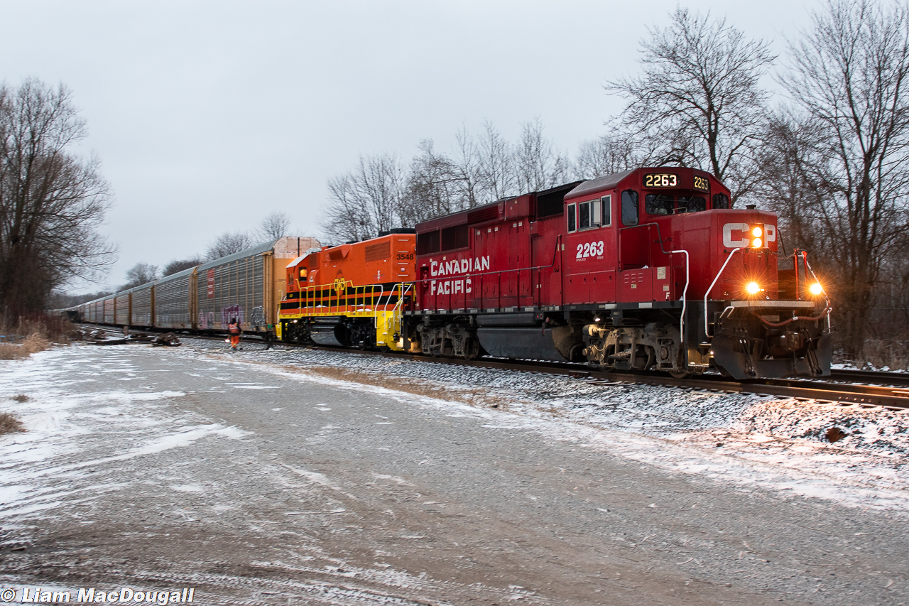 CP T10-27 is seen here making a late evening appearance in the Oshawa siding with a very intriguing lashup of CP 2263 & freshly painted QGRY 3548; a GP38-2 of MoPac heritage. Behind the power is 31 empty autoracks destined for the Oshawa GM plant at some point. 3548 marks the second G&W unit to have been brought to Oshawa (the first being RLK 4095, a GP40 of CN heritage) as the inaugural operating date for the company in Oshawa fast approaches.

 Funnily enough, CP actually ended up needing the extra motive power as the solo GP20ECO was unsuccessful after multiple failed attempts to shove their train up the hill and into Oshawa Yard. They asked Toronto Yard if they could cut in the QGRY unit to make it up into the yard and were given the green light. I recall hearing the crew mention that the GP38 alone likely could've done the shove all by itself unlike their GP20, haha! Overall it was quite a fun & surprising catch to end off a nice chilly day of railfanning, and I'm excited to see what the future holds for Oshawa!