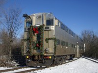 Cab car AMT 900 is decorated for its use in Exporail's Christmas Train as it heads to Des Bouleaux Station on the first run of the morning. The gallery cab car was donated to the museum earlier this year.