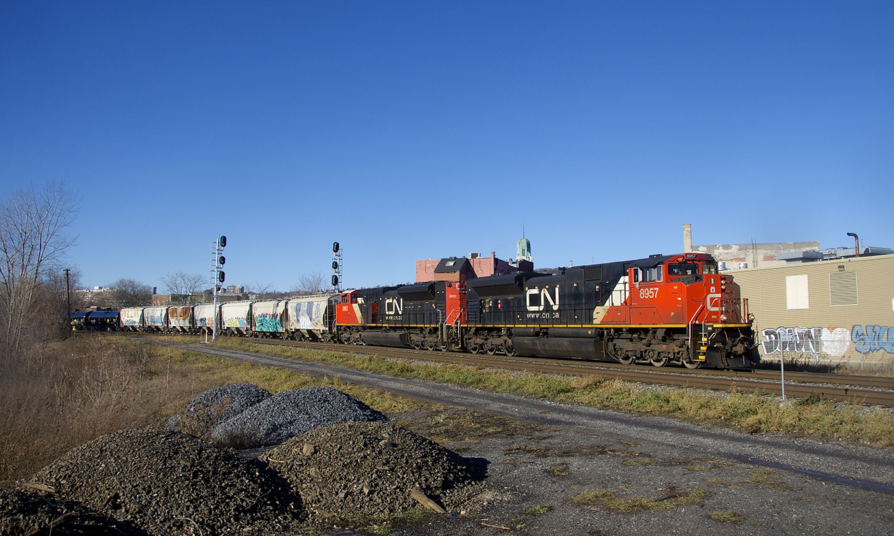 CN 324 is passing MP 3.13 of CN's Montreal Sub as it rounds a curve with a pair of SD70M-2's for power (CN 8957 & CN 8892). The trailing unit was repainted with a white cab roof at some point.