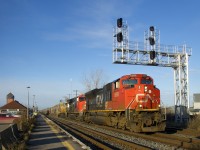 Added as leader at Capreol to put a rare non-AC unit on this train, CN 8888 is passing under a signal gantry as CN B730 roars through Dorval with five units online (CN 8888, CN 3105 & CN 3936 up front, CN 3927 mid-train and CN 2958 on the tail end). This potash train has the usual 205 loaded cars and weighed in at 30,343 tons including the power.