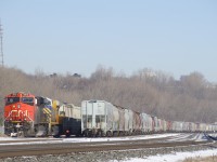 CN 305 is temporarily tied down on Track 29, with CN 2912 & CN 3933 for power. At right are a large number or parked grain cars.