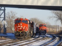 CN 369 is passing a parked CN B730 (loaded potash train) which had already been there a couple of days at that point. It would finally depart eastwards on December 27th.