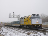 On a cold and slightly snowy morning, VIA 24 has VIA 6402 for power, one of the cleaner F40 wraps. In the distance at far left is a parked CN B730.