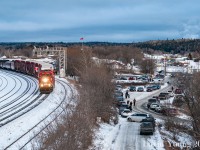 Normally by this time of year we have seen shots of CP's Holiday Train as it travels across Canada. 2021 marked the second year in a row of it's annulment due in thanks to the COVID-19 pandemic cancelling its tour through Canada and the States. However CP did hold another virtual Holiday Train, streamed live from their Ogden HQ in Calgary on December 18th. I offer up this image from a couple years ago of the Holiday Train rolling into their stop at Kenora, Ontario as people gather for the free concert and more importantly, donations to local food banks. Here's to hoping see a return in 2022.<br><br>
Merry Christmas and Happy Holidays everyone! 