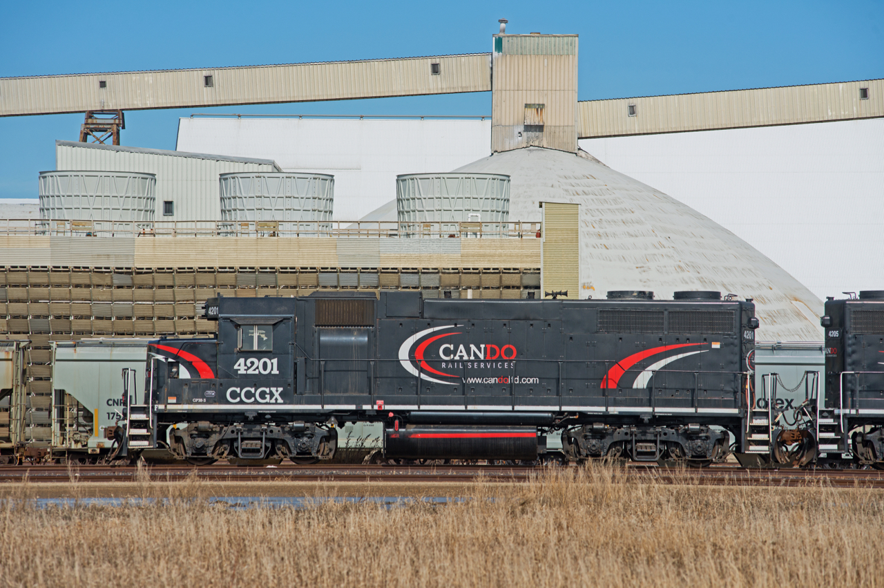 Cando's CCGX 4201 is classified as a GP38AC-3 and started life as DTI GP38 #200 in 1966.  It is seen here in front of the Mosaic potash mine just north of Belle Plaine SK.