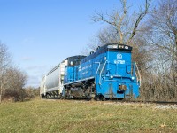 <b>Last call.</b>  The Orangeville Brampton Railway is southbound into the curve just east of Cheltenham with a pile of photographers documenting the final journey.  Immediately to my right, the joints on 1921 stamped rail clink together beneath the passing weight and calmly settle one last time.  Management from GIO Rail, Trillium Railway's holding company, have applied their logo to the front of the "triple 3" with the Owen Sound spur's dates of operation... 1879 - 2021.  The first train departed Orangeville December 2, 1879, and the final one 142 years, 15 days later.<br><br><br><br>The <a href=http://www.railpictures.ca/?attachment_id=26730>OBRY caboose</a> left the property by truck about a month ago, now a private residence near Bala.  The ballast hopper too is sold and will leave by truck.  Note the phone taped to the MU cover... someone has documented some great views of the line.