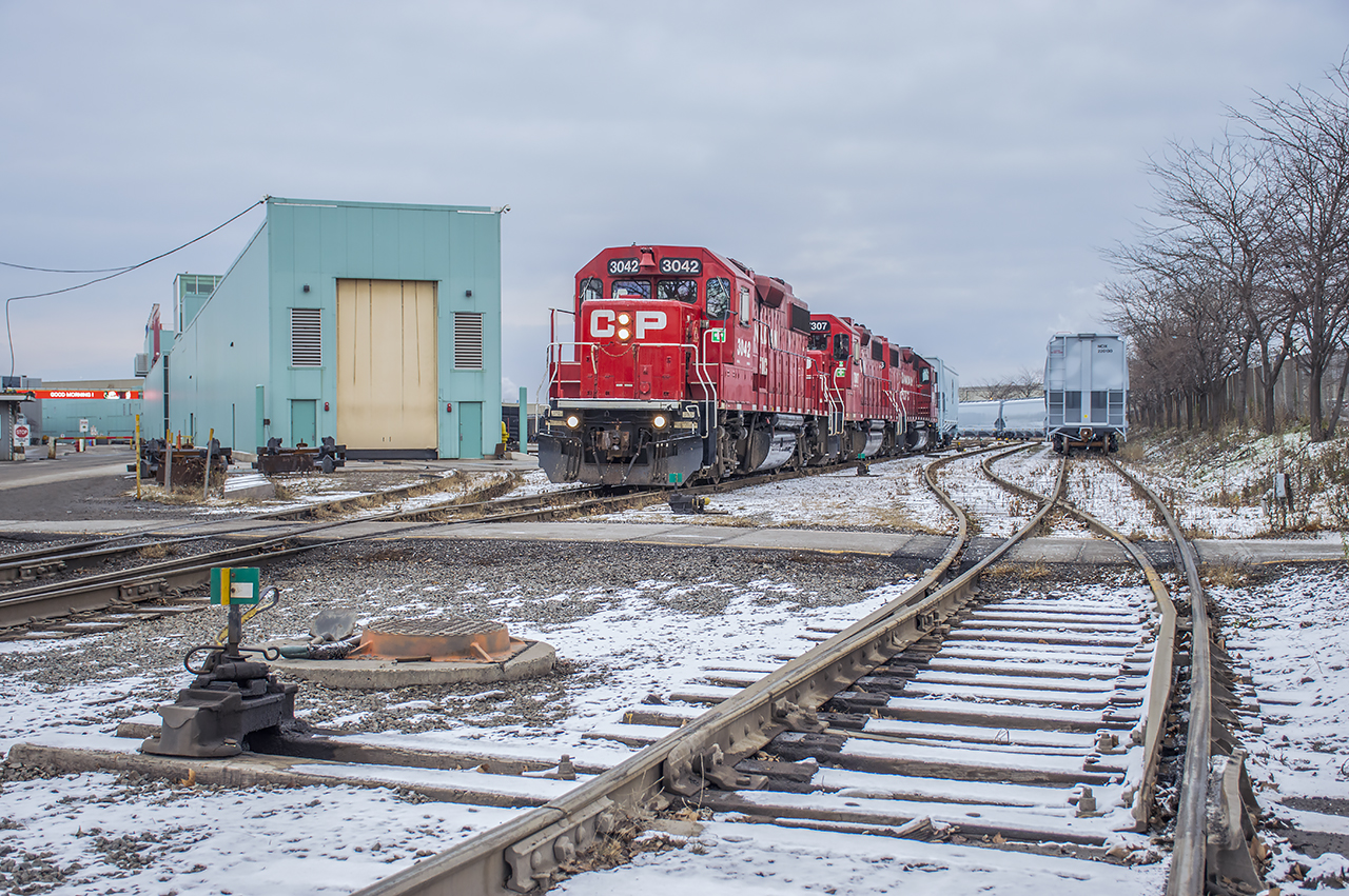 TH11 makes a few moves around National Steel Car gathering up a few cuts of new CP grain hoppers.  They'll be on their way soon and the two NSC yards crews will be back to work.