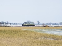 Power for GIO Rail's new Cayuga Subdivision operation arrived in St. Thomas during the night in the form of LDSX 1597, a former CP GP9u that has had some work done, including a new GIO Rail paintjob, by LDS, and it would appear the unit is being leased long term from LDS.  Making it's first run east today, the engine is seen approaching the village of Corinth east of Aylmer headed for Tilsonburg where it will down down at the yard.<br><br>This portion of the Cayuga has seen a lot of work by GIO over the last few months, including thousands of new ties and ongoing work on crossing protection systems for increased speed, requiring most crossings today to be flagged by GIO personnel.<br><br>Built as CPR 8687 in 1957, rebuilt to 1597 in 1985, to <a href=http://www.trainweb.org/oldtimetrains/photos/cpr_diesel/LTEX_1597_1585_DSSR.jpg>Larry's Truck and Electric in 2015,</a> leased to the Delta Southern Railroad and <a href=http://www.trainweb.org/oldtimetrains/photos/cpr_diesel/DSRR_1597.jpg>later purchased and repainted in 2017,</a> and finally to LDS.