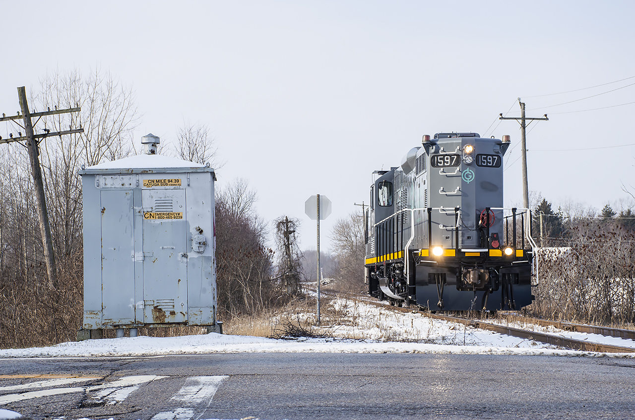 The first train to the south end of Tilsonburg since April 2020 is seen arriving in town about to cross Highway 19/Vienna Road as it enters the Tilsonburg Yard.  It will tie down just east of the crossing.