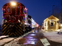 While it was certainly not in the days plans, a lot of pleading from my two boys eventually won me over, finding me heading to St.Jacobs late in the afternoon on Sunday to catch the last Santa trains of the year operated by the Waterloo Central. I have to say it was quite impressive to see, especially the old MLW switchers in action. A few short hours netted a few decent images and put smiles on two boys faces. Here the train is deep into "blue hour" as it awaits the arrival of all the northbound passengers of all ages. The location is the farmers market station.