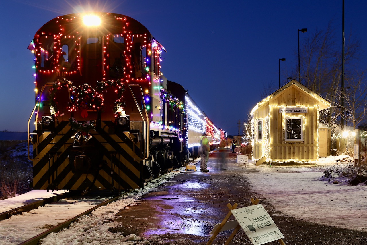 While it was certainly not in the days plans, a lot of pleading from my two boys eventually won me over, finding me heading to St.Jacobs late in the afternoon on Sunday to catch the last Santa trains of the year operated by the Waterloo Central. I have to say it was quite impressive to see, especially the old MLW switchers in action. A few short hours netted a few decent images and put smiles on two boys faces. Here the train is deep into "blue hour" as it awaits the arrival of all the northbound passengers of all ages. The location is the farmers market station.