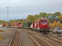 Seen from the rear of departing VIA #185, CP GP9u 8212 and sister 8215 shuffle cars between the yards in Sudbury.