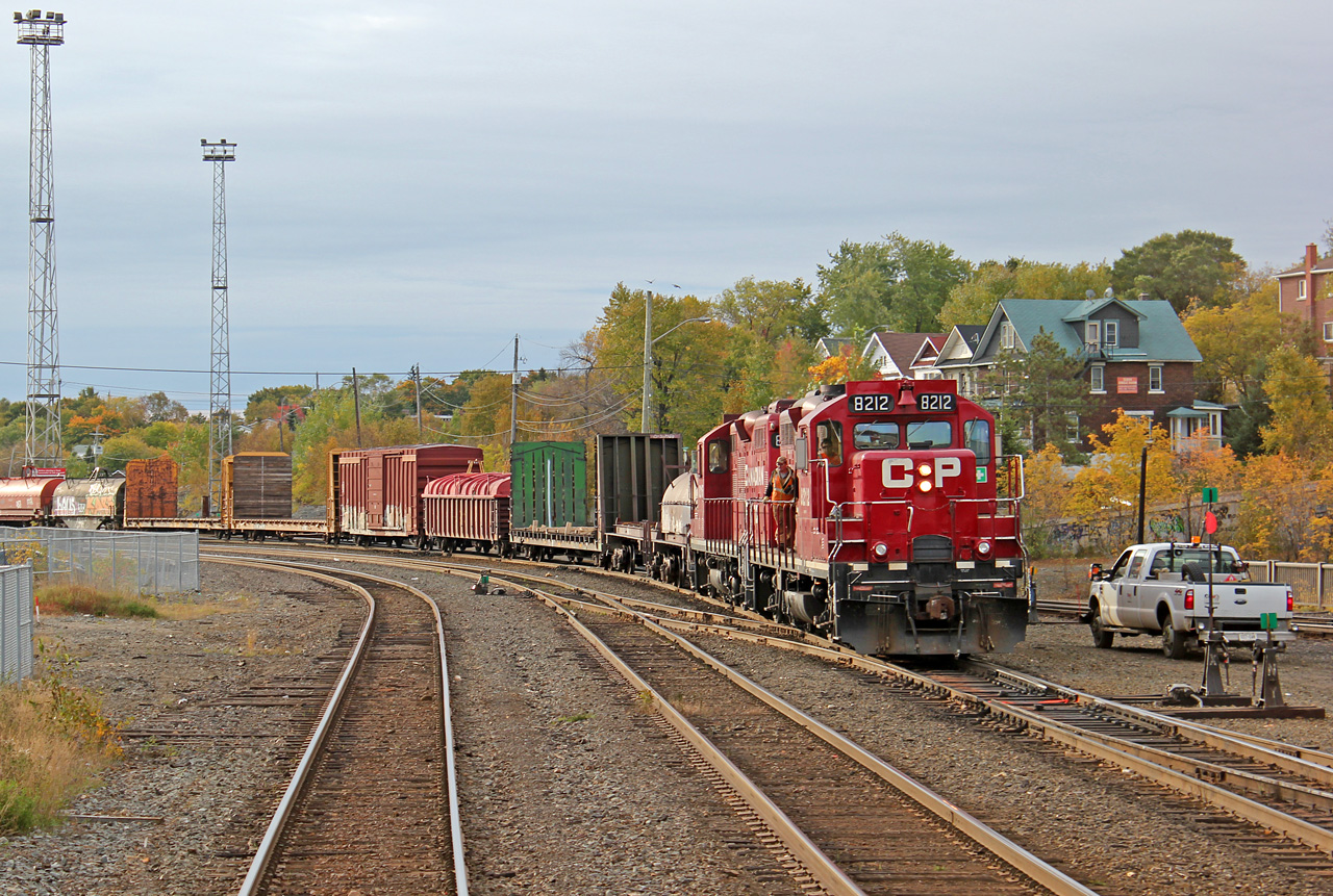 Seen from the rear of departing VIA #185, CP GP9u 8212 and sister 8215 shuffle cars between the yards in Sudbury.