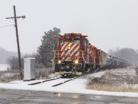 A fine pair of former CP GP9us still wearing their action red paint take the St. Thomas turn south nearing Belmont.