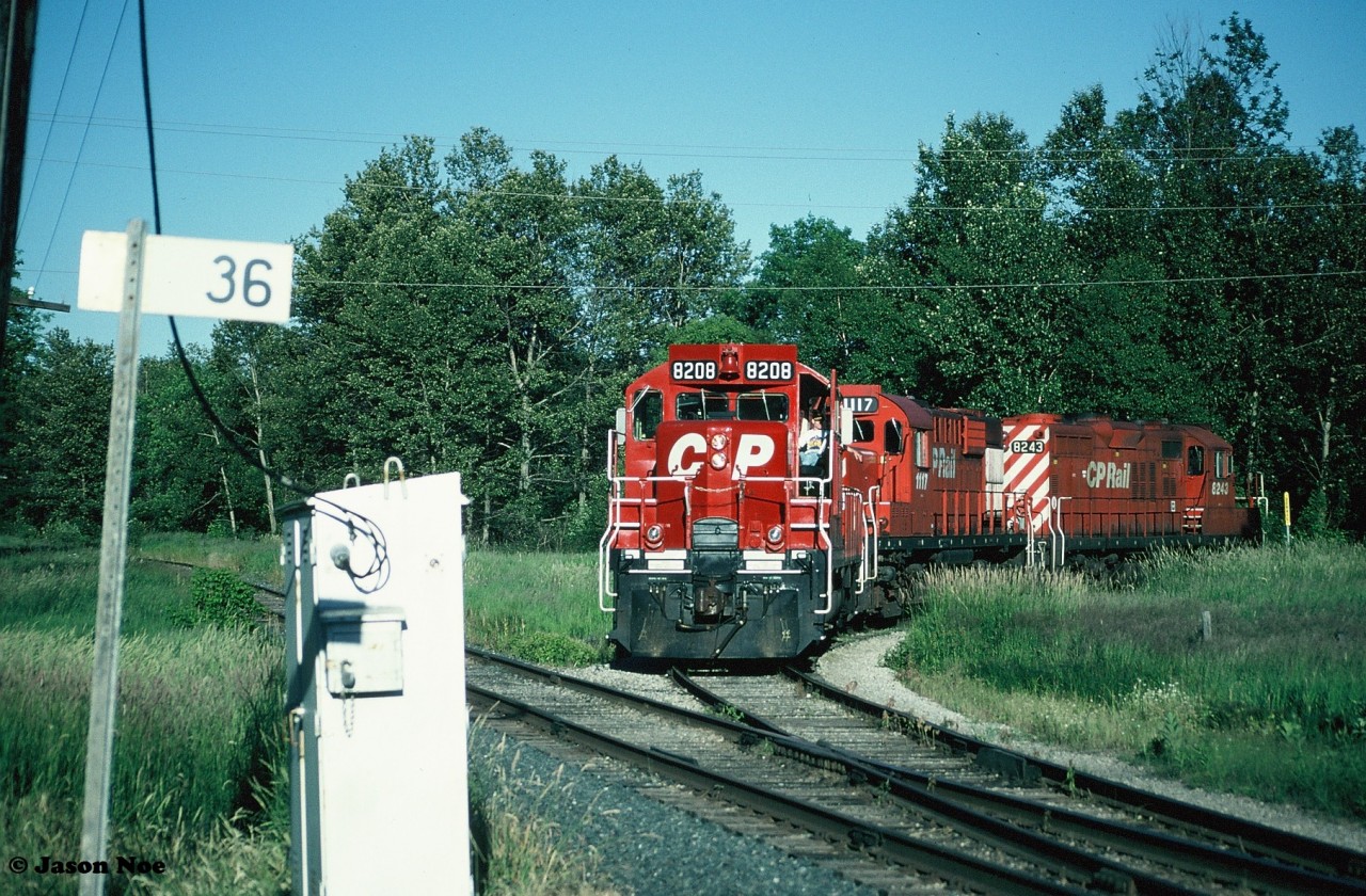 Sitting at Mile 36 on the CP Owen Sound Subdivision, units 8208, 1117 and 8243 are viewed idling a summer’s night away while most of the crew headed to Tim Hortons to get some food. Shortly they would return and the unit’s would depart light power back to the yard, where the crew would lift their cars for the trip back to Streetsville.