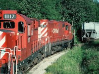 Seen from the cab of the Moonlight, units CP 8208, 1117 and 8243 have just set-off the two covered hoppers by the plant behind the Tim Hortons in Orangeville that today is Roechling Engineering Plastics. It might have still been named that during 1997. 