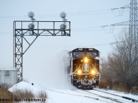 A shot you can't do in the winter in sun, 3008 east is passing under the classic Mansewood CTC signals as they rush for Toronto yard with an IC painted GE in the lead.