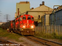 Summer days, those long warm evenings where you could find sunshine closer to 2100... and I found the CNR Hamilton 1500 job with three matching 7000 series GP9's working the TH&B (CP) Adam's Yard in Hamilton. Dofasco is at right and where the Dofasco mainline once was stands a new fence. A recent visit I noted the rest of the Dofasco mainline is being ripped out around Ottawa St toward Depew. I hate November and December weather - take me back to these warm summer days!