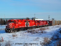 Arriving at the north end of Hagey Yard, the Galt job is about to start working as they cross over Sportsworld Drive. The two GP9's are likely new power for the Hagey Yard job. The Galt job ran from Galt to Hagey and back daily with autoracks for Toyota. This job was replaced when Wolverton Yard was built and was changed to T72 and now originates there instead. This was every day stuff back then, the 3097/3105 seemed to be assigned to the Galt job for years. Now folks go nuts when any action red shows up