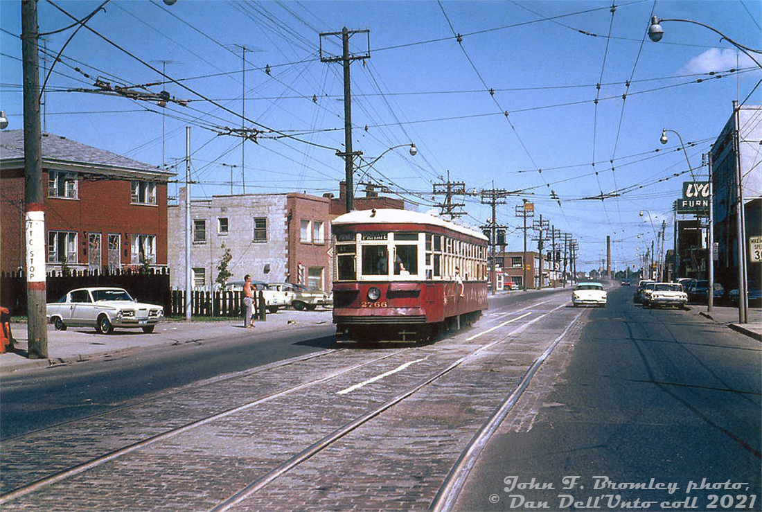 TTC Peter Witt streetcar 2766 is operating on a fantrip around the city today, seen here heading southbound on Weston Road at Northland Avenue after looping at Avon Loop at the north end. The sign for the art deco-ish Lyons Furniture store (now a self-storage place) is visible on the right. While most of the Witt fleet fell out of use when the University Subway line opened in February 1963, a few cars like 2766 were kept around for occasional use and fantrips. As of January 1965 there were 13 cars left on the property, but most were sold for scrap early that year. July was the final month of Peter Witt operation before the final active car, 2766, was retired (but was kept, and later overhauled and brought back in Tour Tram service in 1973).This stretch of streetcar track on Weston Road was once home to the old Weston Road streetcar service (from West Toronto to the town of Weston), but by this time the remaining section from St. Clair to Avon Loop (at Rogers Road) only saw some rush hour St. Clair streetcars. The final cars ran on February 25th 1966, the day before the new Bloor-Danforth subway opened and streetcar network revisons came into effect (St. Clair cars then ended their runs at Keele Loop, and the tracks up Weston were abandoned).John F. Bromley photo, Dan Dell'Unto collection print.