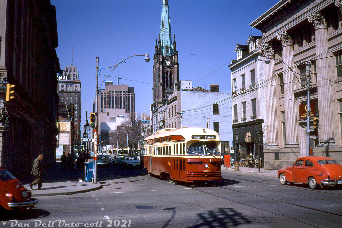 TTC 4384 (an A6-class PCC built by CC&F in 1947-48) heads eastbound on King Street on the King route, about to cross Jarvis Street in late morning traffic. St. Lawrence Hall, the King Edward Hotel, the Cathedral Church of St. James, and the local CIBC bank branch are a few of the notable buildings in this scene taken east of the downtown core (I spy a VW Beetle on the left, but can anyone ID the car on the right? Looks like a 50's design).

Original photographer unknown, Dan Dell'Unto collection slide.