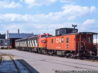 Power for train 725, the Nanticoke Steel train, sits at the Hamilton diesel shop with Hawker Siddeley van 79301, one of 150 built in 1967 in the 79200 - 79349 series.

<br><br><i>Original Photographer Unknown, Jacob Patterson Collection Slide.</i>
