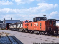 Power for train 725, the Nanticoke Steel train, sits at the Hamilton diesel shop with Hawker Siddeley van 79301, one of 150 built in 1967 in the 79200 - 79349 series.

<br><br><i>Original Photographer Unknown, Jacob Patterson Collection Slide.</i>