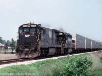 A Pair of Norfolk & Western engines (C30-7 8035, and SD40-2 6092) passing through Delhi, ON on their way to Detroit. Map location is an approximate guess 