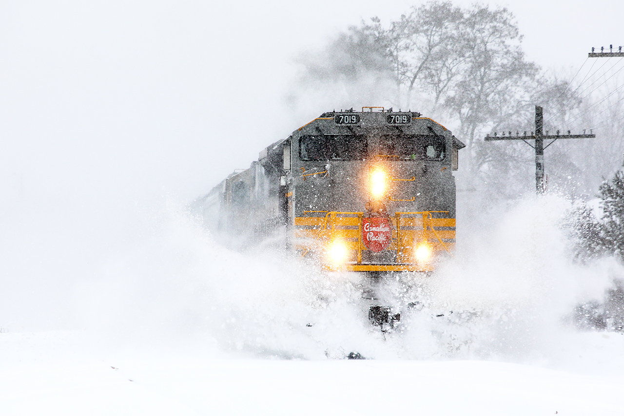 Ontario is having a special day...a foot of snow so far in Cambridge. Our plows are usually very good at not leaving windrows.....but not today. After a 90 minute wait, 234 (whose crew is not having a great day having left London at 5am) cleans out the crossing with BNSF SD70MAC 9572 still trailing...somewhere in there. For the crew, hopefully, a straight shot into Toronto; which is getting even more snow than this. For me, Canadian railroading at its best, but to have a Heritage leader as well, stupendous.