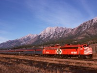 Once a simple and reliable daily sight, but now history for many years, No. 2 The Canadian is seen here on Monday 1974-10-14 at 1410 MDT departing Canmore with a typical all-stainless consist led by 1402 and 1404.