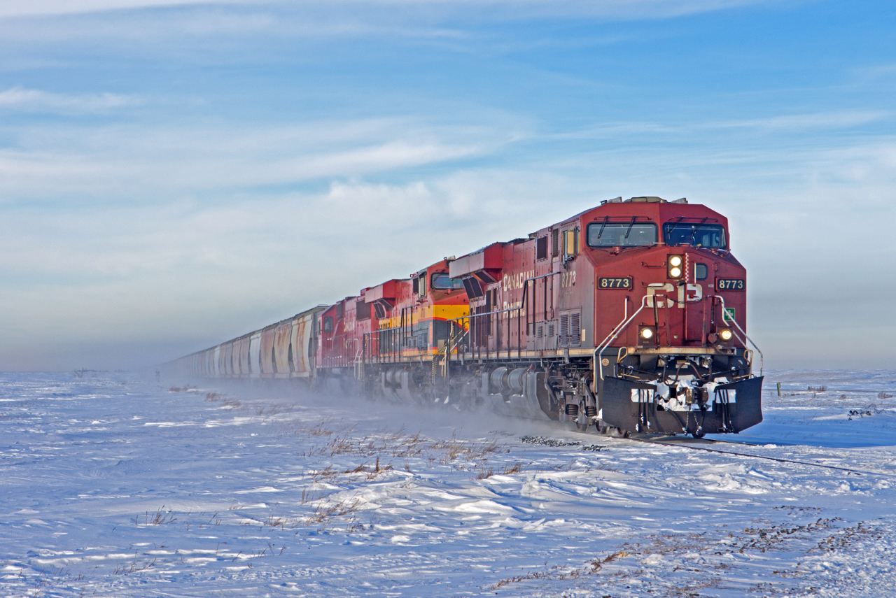 CP 8773, KCS 4708, and CP 6300 lead a loaded potash train through Albatross SK and into the north end of Regina on the Lanigan Subdivision.
