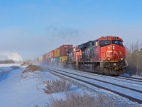CN 196 has a fresh crew aboard and is just leaving the outskirts of Saskatoon. -42C temperatures and little to no wind made for some interesting lighting conditions as any moisture in the air would simply linger. 