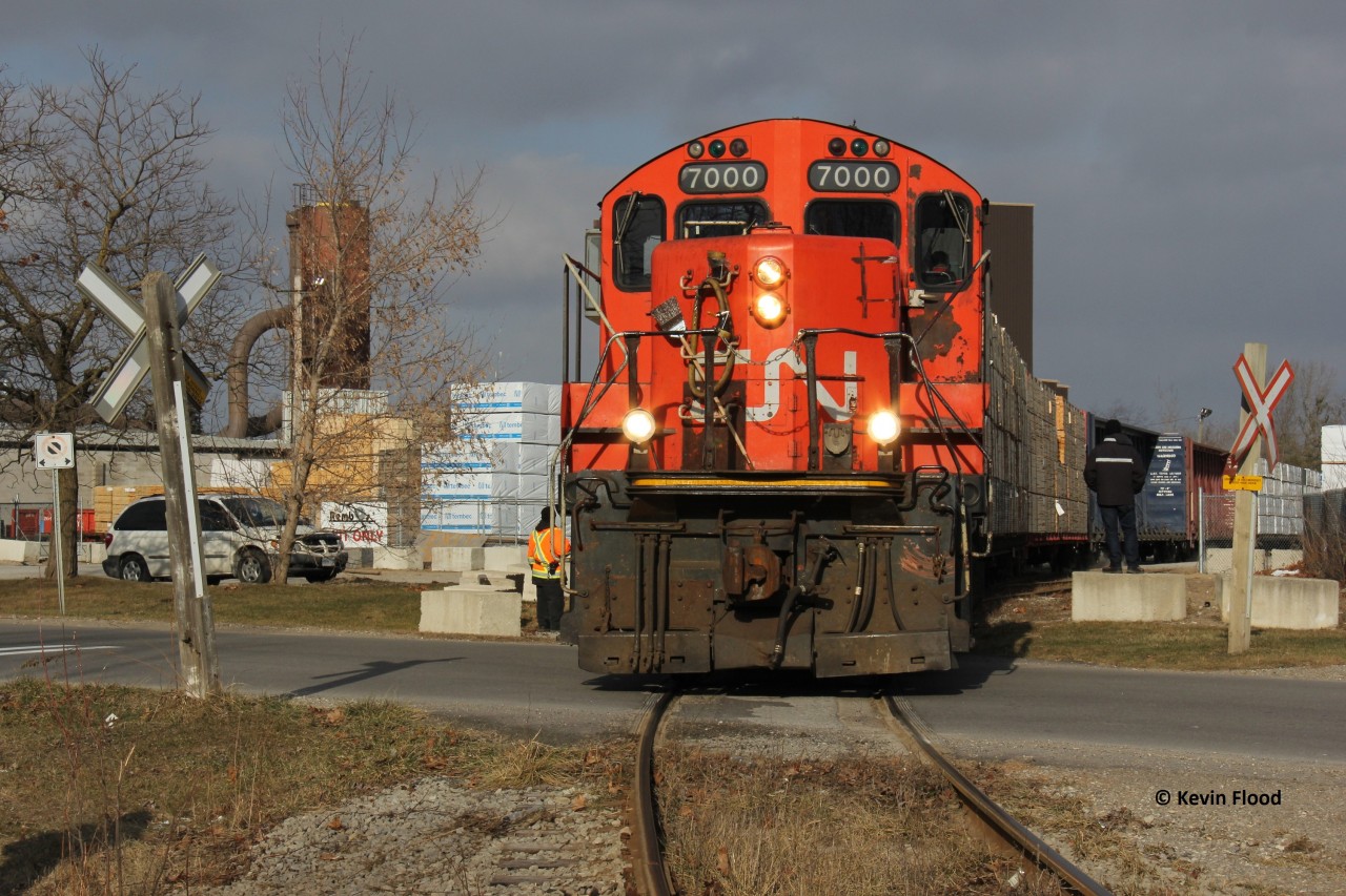 On the last day of 2014, what I think is CN 580 is pictured backing into place to switch out lumber cars. A current Google Maps search indicates this facility to be Rembos Inc., and the road in the foreground is Old Onondaga Road. Happy New Year everyone!