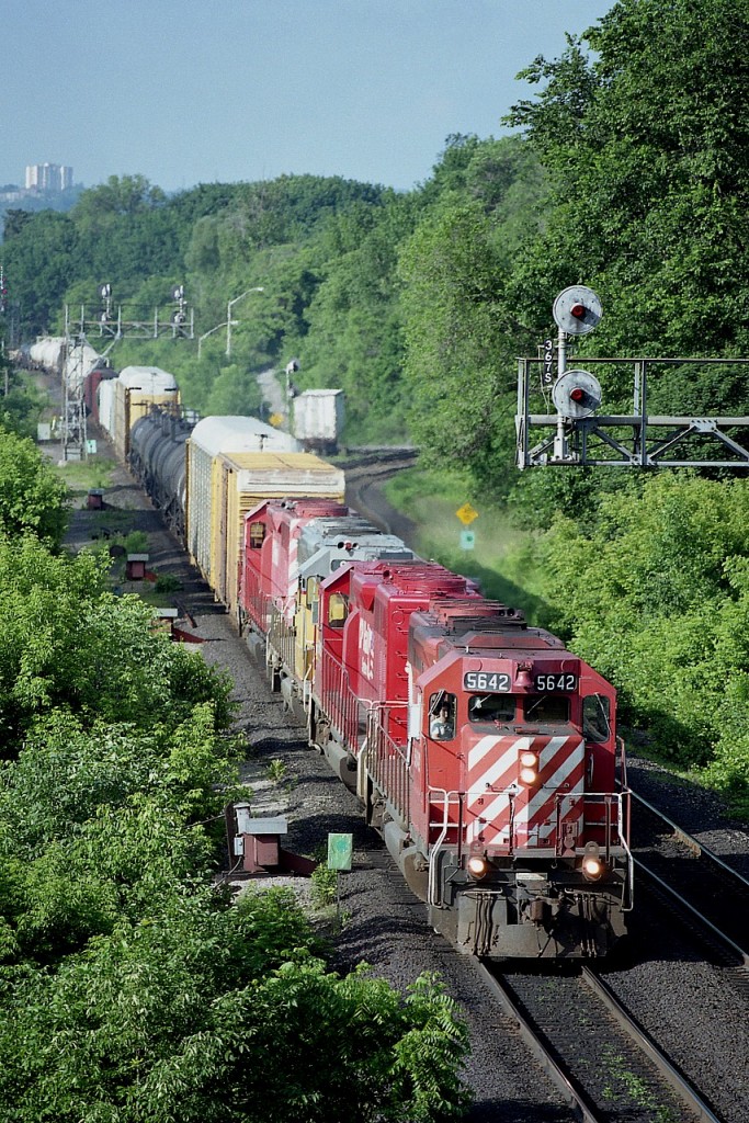 Back when the trains were more interesting; leasing numbers on CP were high; CP had an agreement to run over CN oakville sub and the days railfanning were quite enjoyable, many of us were out as often as possible.  This is typical CP traffic on a nice warm June morning. CP 5642, 5616, GATX 902 and CP 5665 are the units up front. The GATX SD40-2 was the former UP 3902.