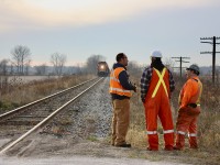 The Canada Southern was definitely one of those Canadian railroads I wish I could have railfanned. Unfortunately I missed the last through trains over the line by mere months. I did manage to spend a lot of time along the line in its discontinued state, taking as many images as I could. Visits to places like Canfield, Waterford, Tillsonburg and of course St. Thomas still intrigued me, even if I didn’t even see a train. The abandonment signal system and removed second track created unique images. I enjoyed catching the few St.Thomas Central tourist trains with ETR steamer #9 in the lead heading to Shedden. Today most traces of the old CASO have been scraped clean off the roadbed and in many locations the roadbed itself is gone. I missed the removal of the east end of the CASO, but made sure I at least witnessed the removal of the west end once. This day I departed Mississauga under the cover of darkness, arriving at Comber by mid morning. I didn’t catch up with the rail removal train until South Woodslee. The train would take the entire day to remove just a few miles of track, but it was all worth it for the several memorable images I would capture. By 4pm it was time to head home and the last image found some of the train crew waiting for CP 6030 to meet them at the crossing as it lifted another section. The setting Sun highlighting the tree line in the distance and almost forgotten decomposing telephone poles along the old mainline.  Farewell CASO!