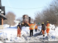 A little winter humour. The clean up crew are making the most of a frustrating day so far after being called out to clear the filled in crossing and switch in front of the old TH&B station in Brantford. The line beyond here was taken out of service when CN convinced the last on line customer to switch to trucks. This day 580 was forced to run around its train here thanks to problems with the switch at the other end of the line. This was most likely the last time a train passed here before this end of the line was abandoned. Today sadly only the old boarded up station remains and another section of interesting rails are gone from Brantford.