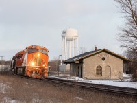 CN M369 rounds the curve at mileage 198, by the Napanee station in its original Grand Trunk Railroad structure. Leading 369 is 3023, which is painted in tribute to the former Elgin Joliet & Eastern Railroad, which CN now owns all the rights to. 369 is about 20ish miles to Belleville, where the Montreal crew will do a crew change, and give the rest of the run to a new crew taking the train to Toronto’s Mac Yard.
